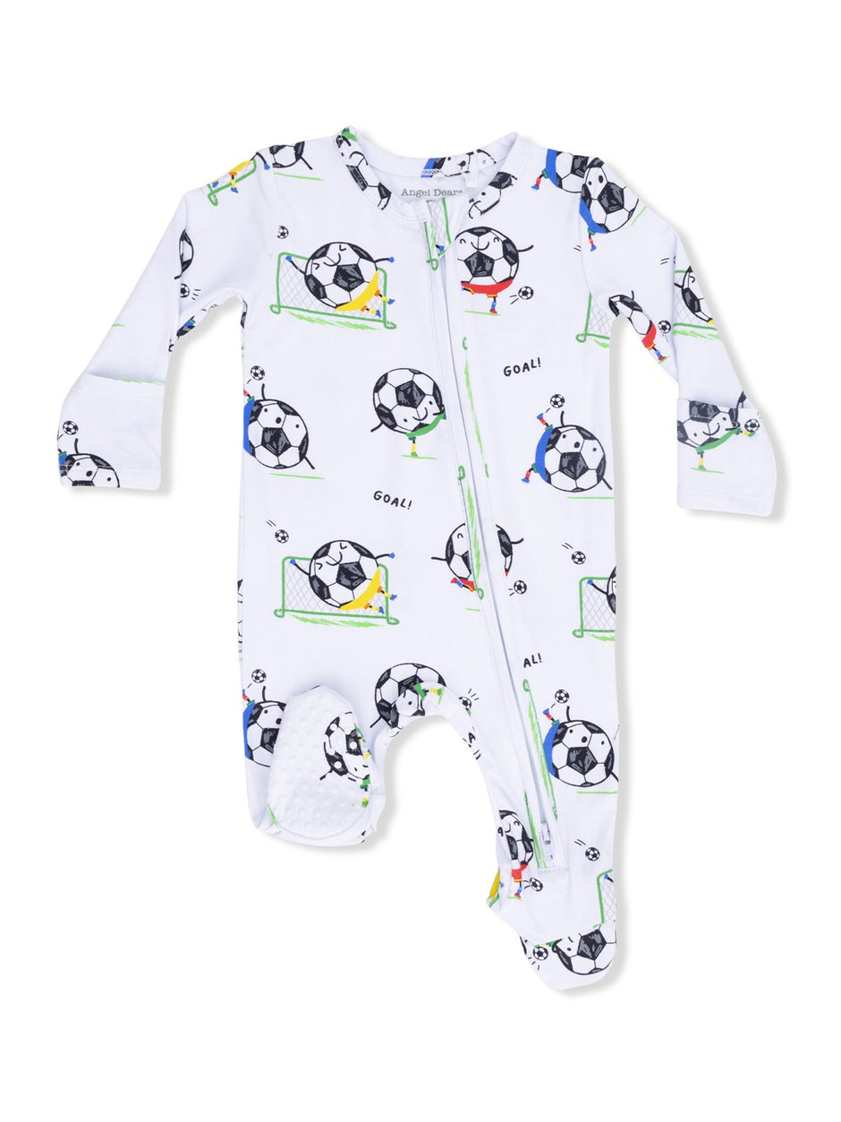 White baby onesie with soccer-themed print, featuring cartoon soccer balls and players in action.