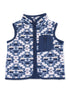 Navy and white fleece vest with geometric pattern and zip pocket, ideal for layering in cooler weather.