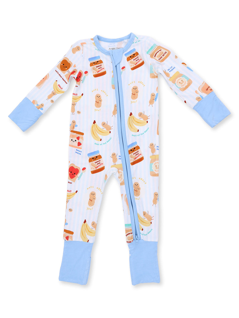 Infant onesie with colorful prints of bananas, teddy bears, and food items, featuring a front zipper and blue cuffs.