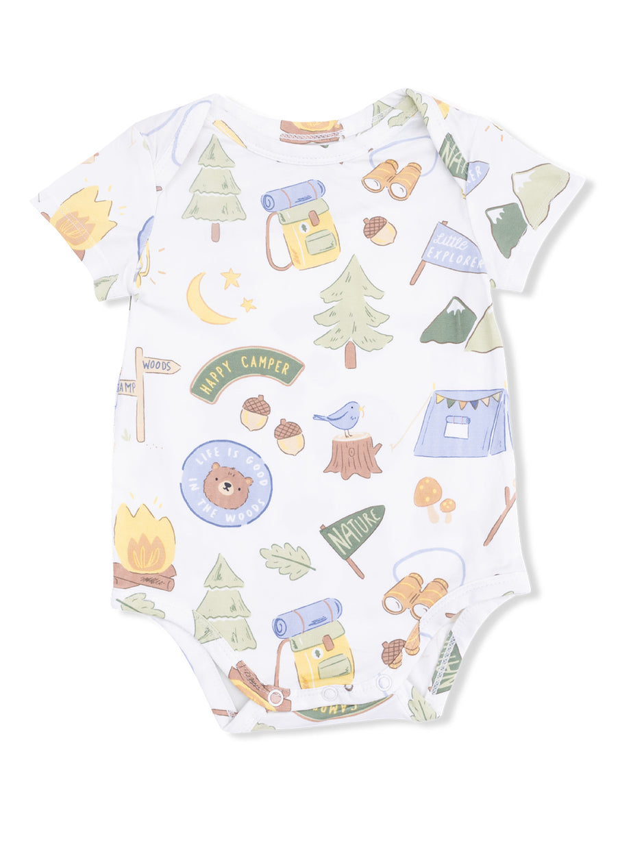 Baby onesie with nature-themed illustrations including trees, a bear, and camping gear. Ideal for outdoor adventures.