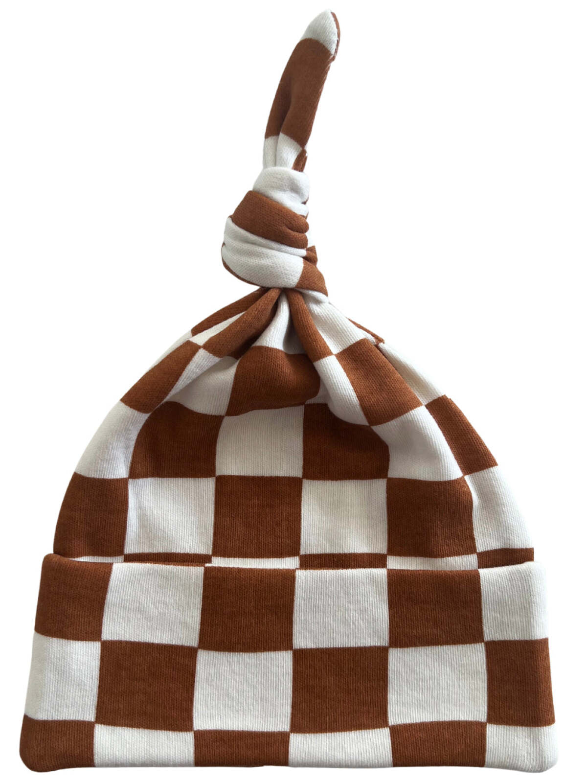 Brown and white checkered beanie hat with a twisted top knot design.