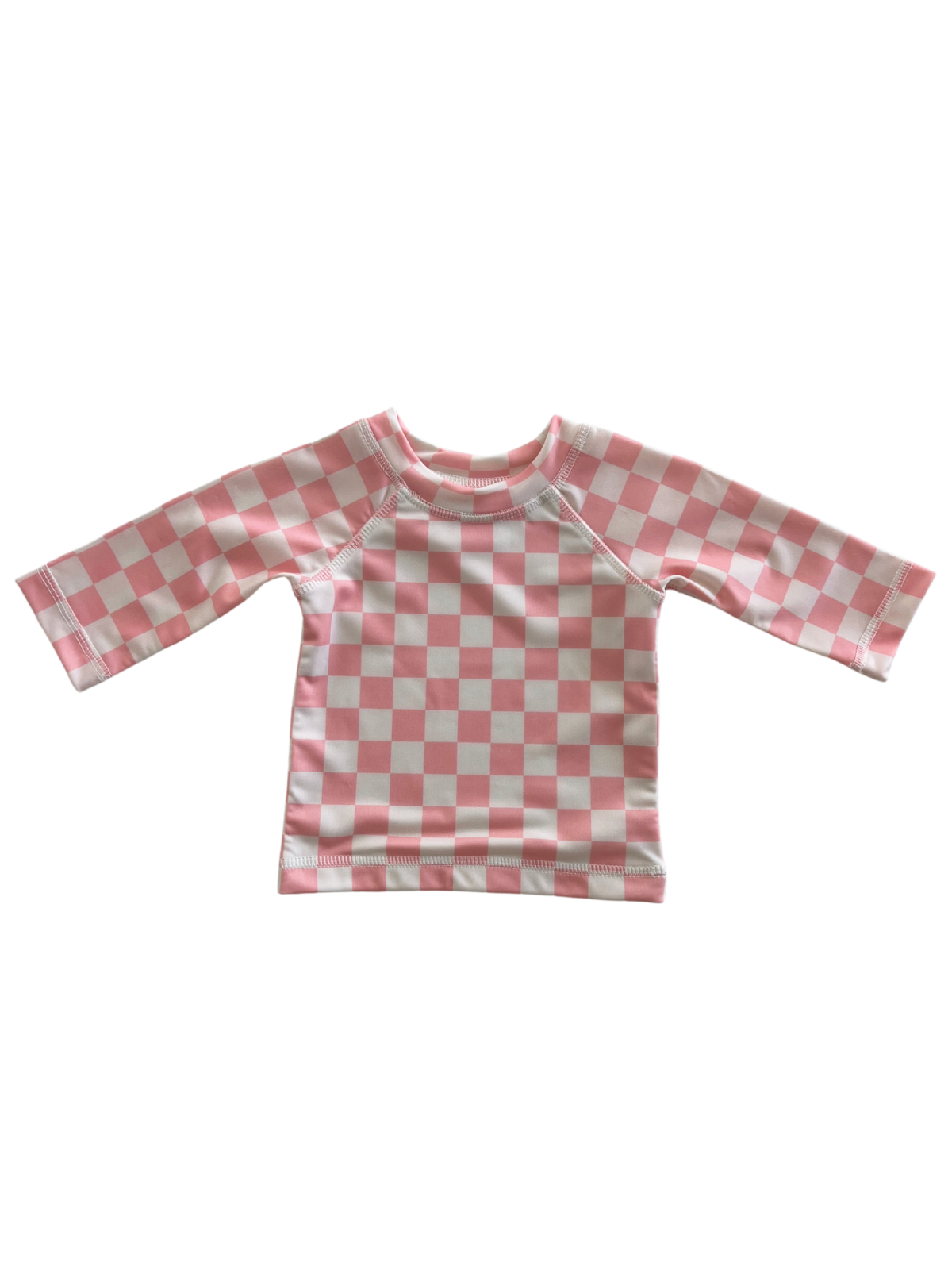 Pink and white checkered long-sleeve children’s shirt on a white background.
