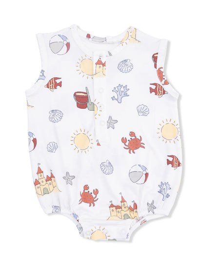 White baby romper with beach-themed prints: crabs, seashells, sun, and castles in pastel colors.