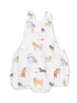 White romper featuring various playful dog illustrations in soft, colorful designs. Perfect for dog lovers.