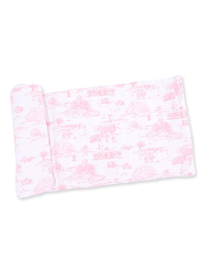 Pink patterned pillowcase featuring scenic illustrations of trees and rural landscapes.