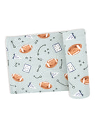 Light blue fabric featuring footballs, play diagrams, and "Go Team" text in a playful pattern.