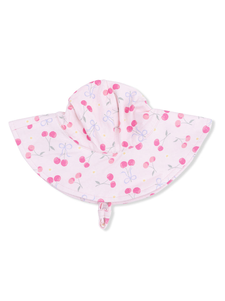 Light pink sun hat with cherry and bow pattern, designed for children's sun protection.