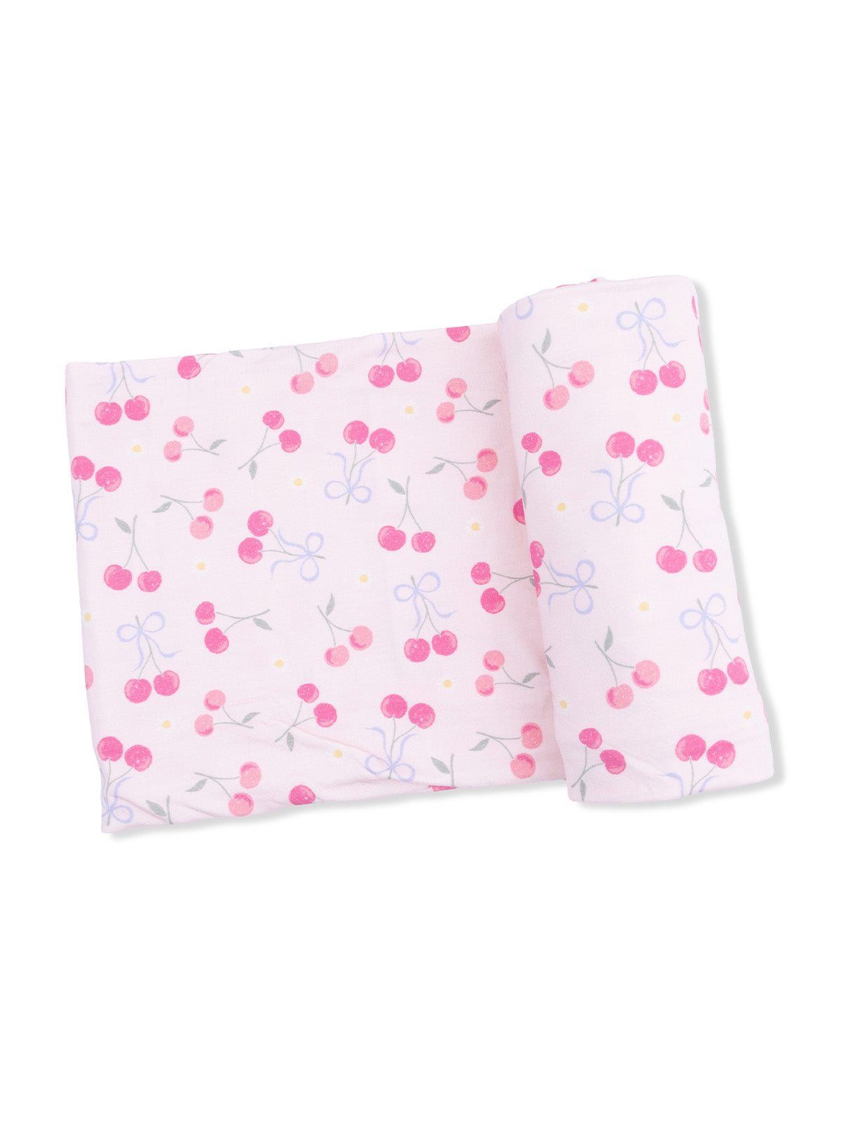 Pink fabric with a cherry pattern, featuring red cherries and blue bows scattered across a soft background.