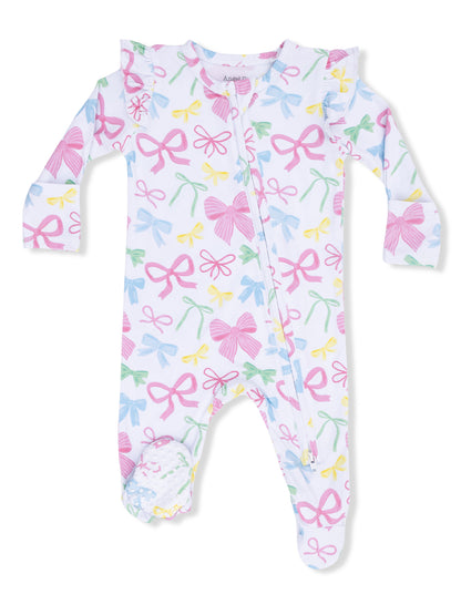 Baby onesie with colorful bow print, featuring ruffled shoulders and a front zipper.