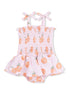 Pink baby romper with orange fruit print, smocked top, and ruffled skirt. Features shoulder bows.