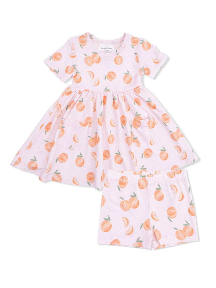 Pink dress with peach print and matching shorts, featuring a flared skirt and slight puff sleeves.