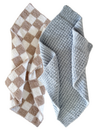 Two textured towels: one with brown and white checkered pattern, the other in soft gray knit, overlapping each other.