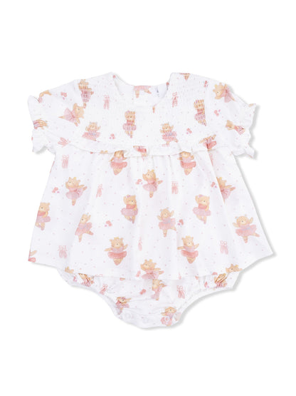White baby dress with bear print and pink accents, featuring ruffled sleeves and snap closure at the bottom.