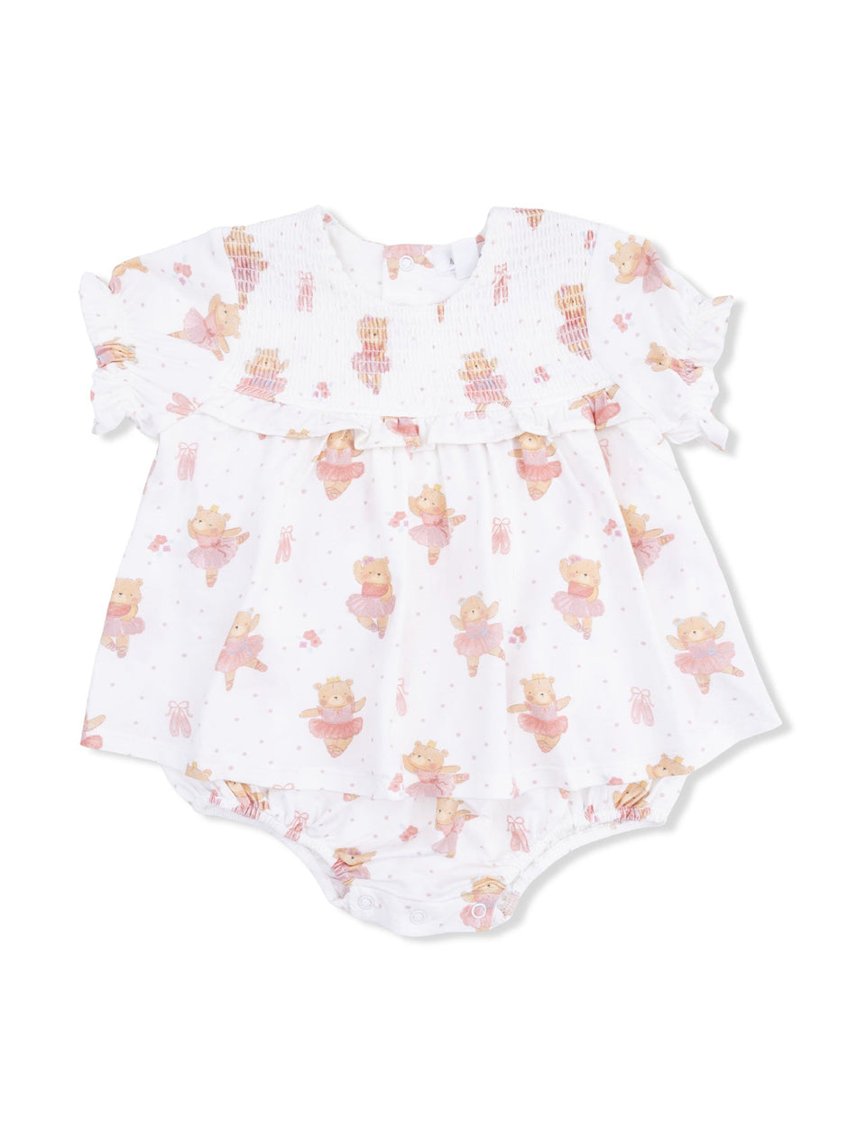 White baby dress with bear print and pink accents, featuring ruffled sleeves and snap closure at the bottom.