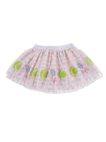 Pink plaid skirt with tennis-themed embellishments, featuring green tennis balls and rackets.