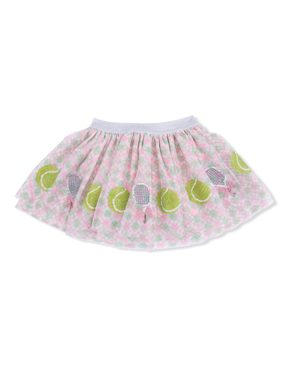 Pink plaid skirt with tennis-themed embellishments, featuring green tennis balls and rackets.