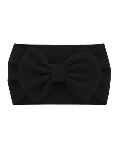Black fabric headband with a large bow at the center, showcasing textured material. Ideal for stylish hair accessory.