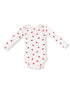 Long-sleeve baby bodysuit in white with red apple print pattern.