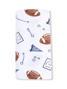 Football-themed fabric with brown footballs, play diagrams, and “Go Team” flags on a white background.