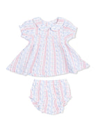 Lightly patterned baby dress and bloomer set in soft colors with a rounded collar and flutter sleeves.