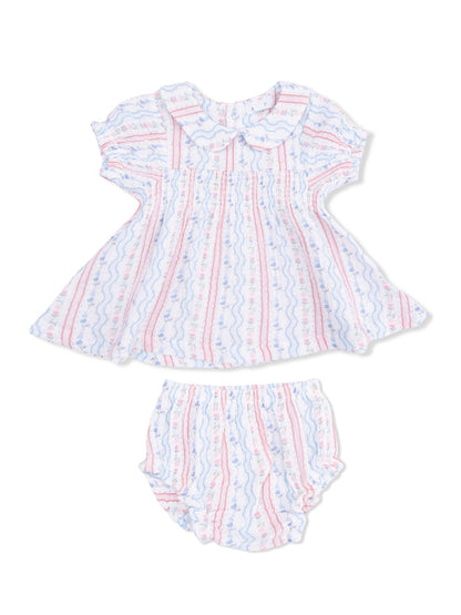Lightly patterned baby dress and bloomer set in soft colors with a rounded collar and flutter sleeves.