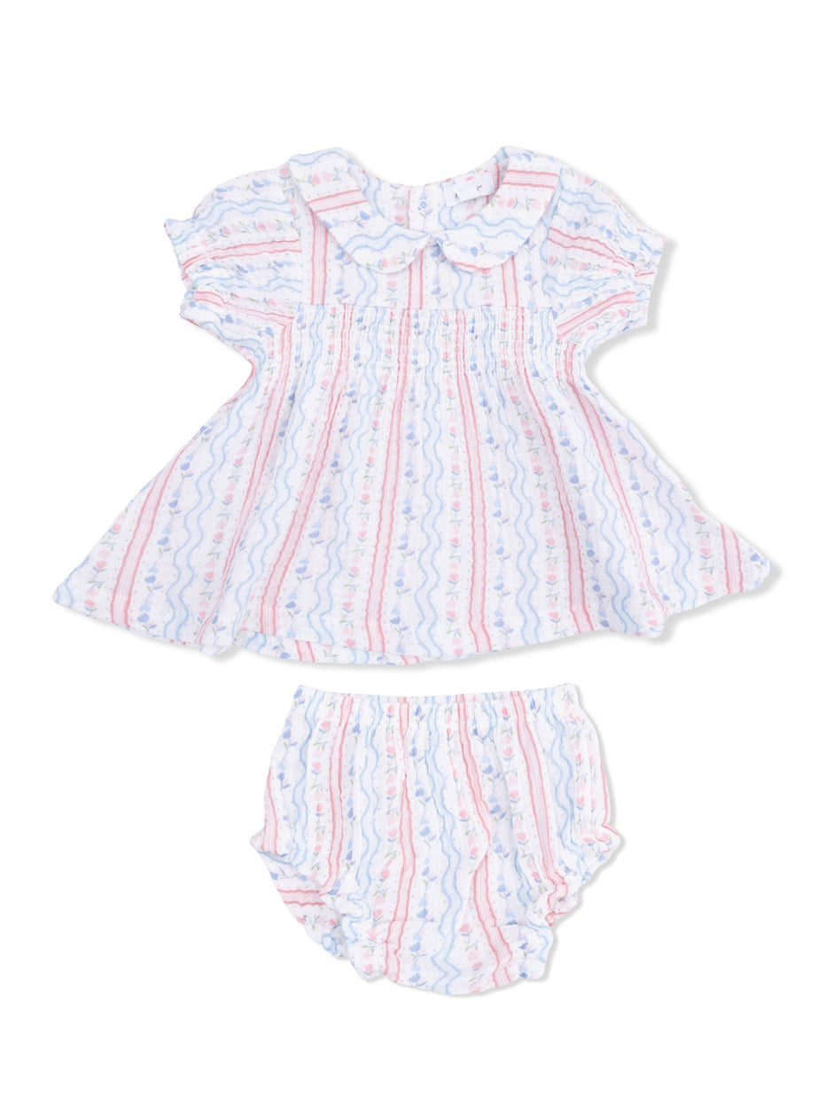 Lightly patterned baby dress and bloomer set in soft colors with a rounded collar and flutter sleeves.