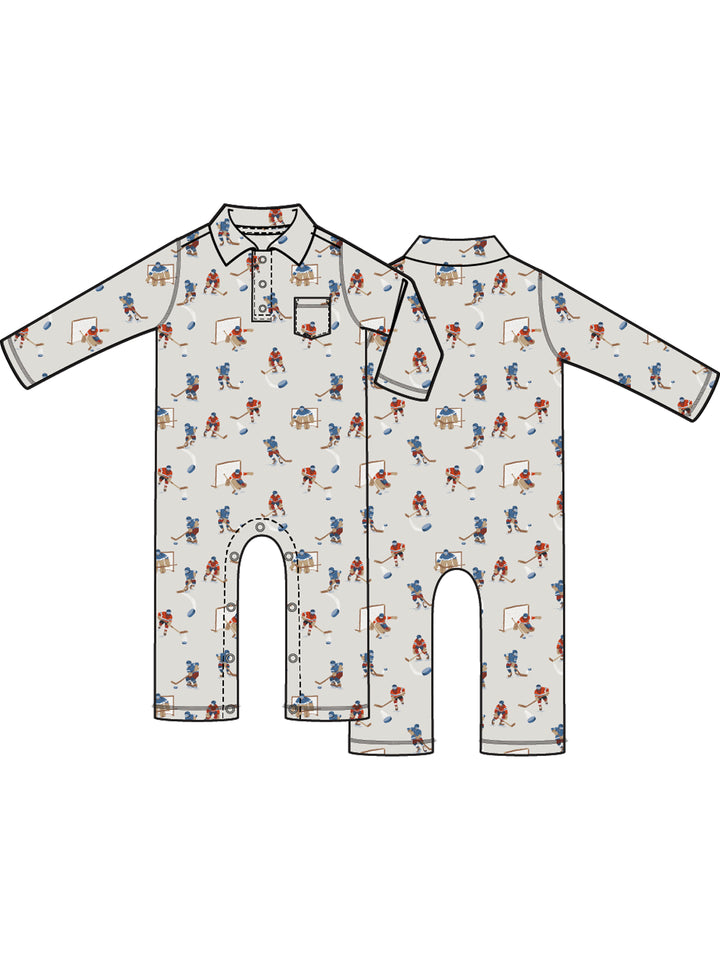 Children's long-sleeve onesie featuring playful hockey-themed pattern in soft neutral colors.