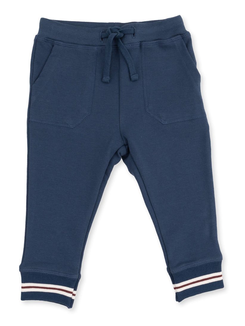 Navy blue sweatpants with pockets and striped cuffs. Ideal for casual wear or exercise.
