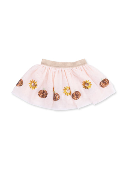 Pink skirt with floral and pumpkin embroidery, featuring a gold waistband. Ideal for casual or festive wear.