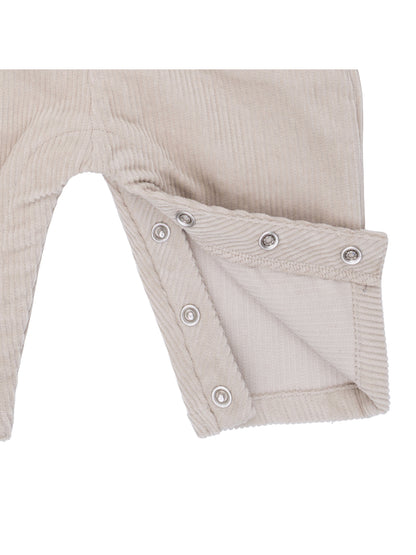 Beige corduroy pants featuring snap closures at the legs for easy dressing and comfort.