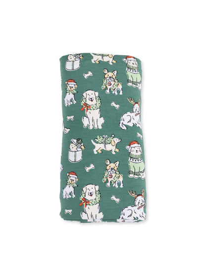 Green fabric featuring playful dogs in festive attire, including Santa hats and Christmas decorations.