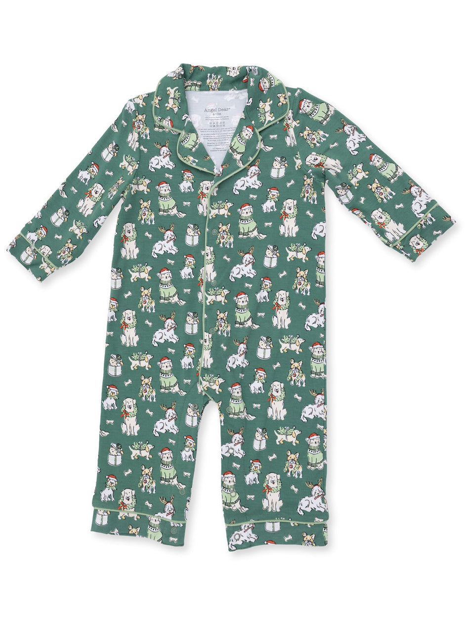 Green children's pajamas featuring playful dog graphics in festive attire. Perfect for cozy sleepwear.