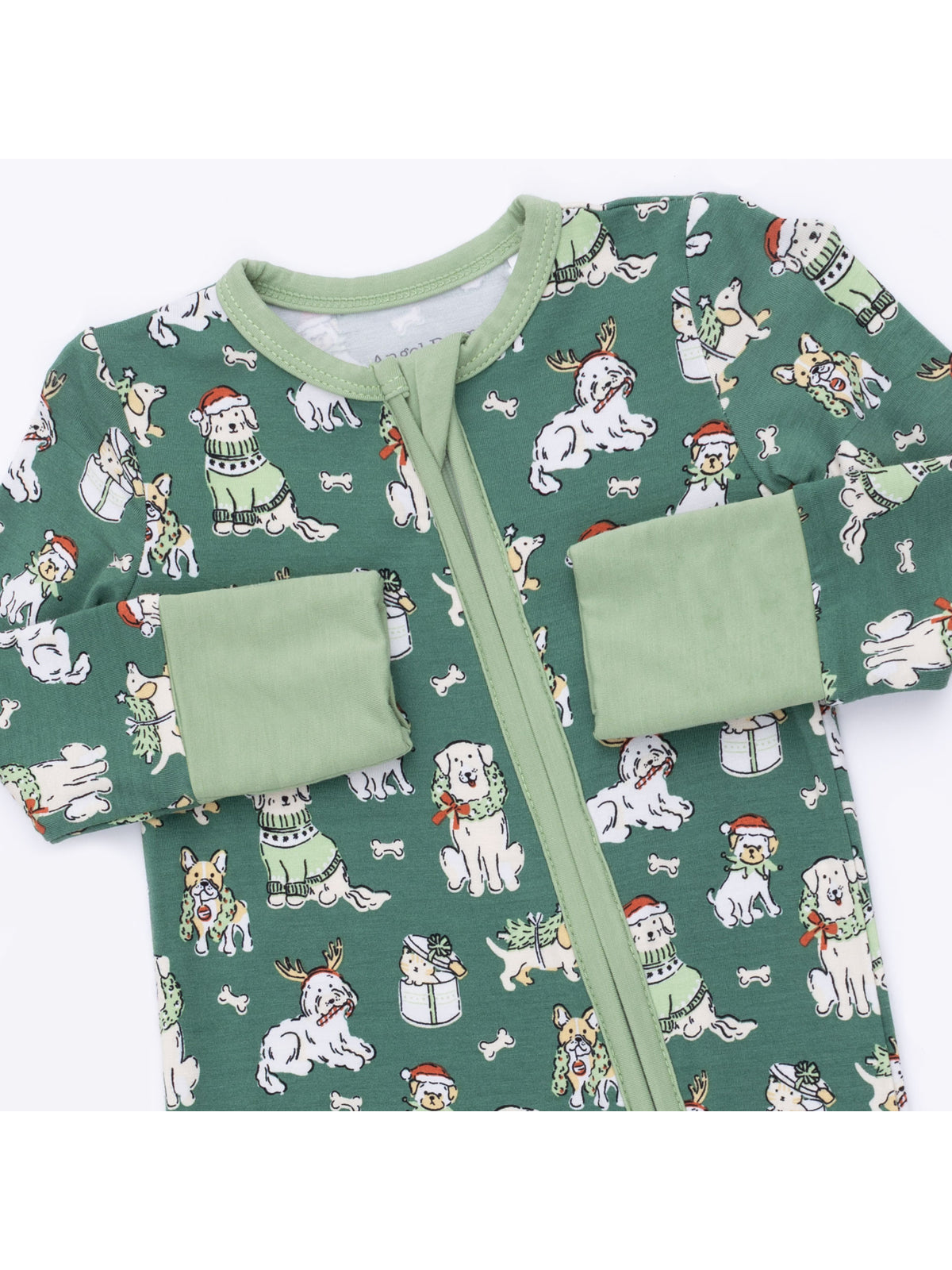 Green holiday onesie with playful dog illustrations wearing festive accessories. Perfect for cozy winter wear.