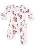 Children's onesie featuring playful cartoon characters, cacti, and campfire motifs in vibrant colors.