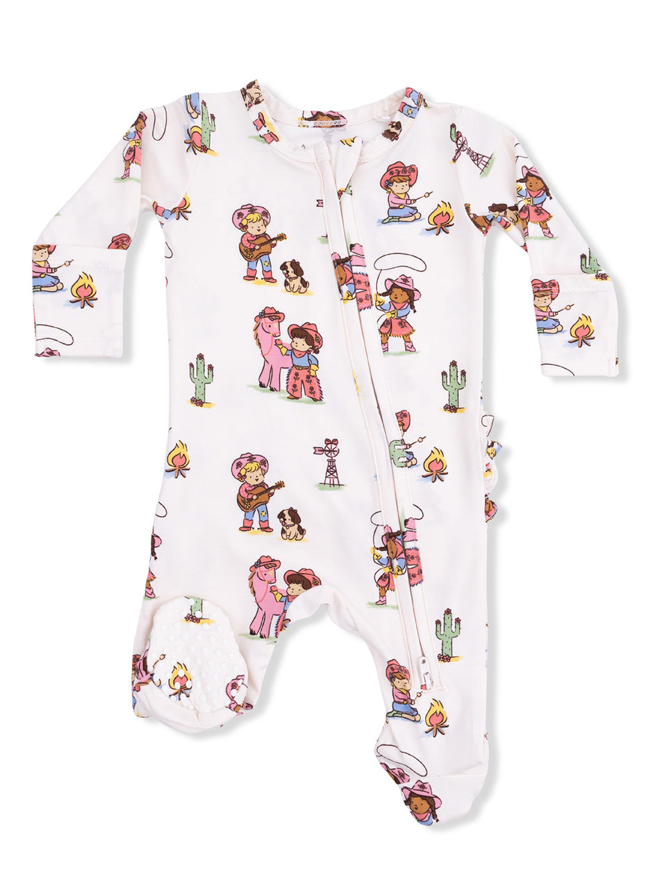 Children's onesie featuring playful cartoon characters, cacti, and campfire motifs in vibrant colors.