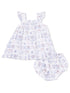 White baby dress with ruffled sleeves and matching bloomers featuring colorful, playful patterns.
