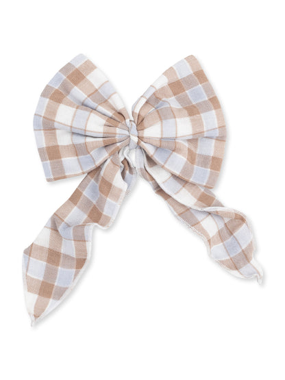 Brown and white checkered fabric bow with long tails on a white background.