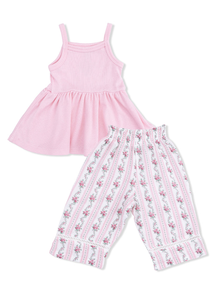 Pink sleeveless dress and floral print pants set for kids, featuring a playful and stylish design.