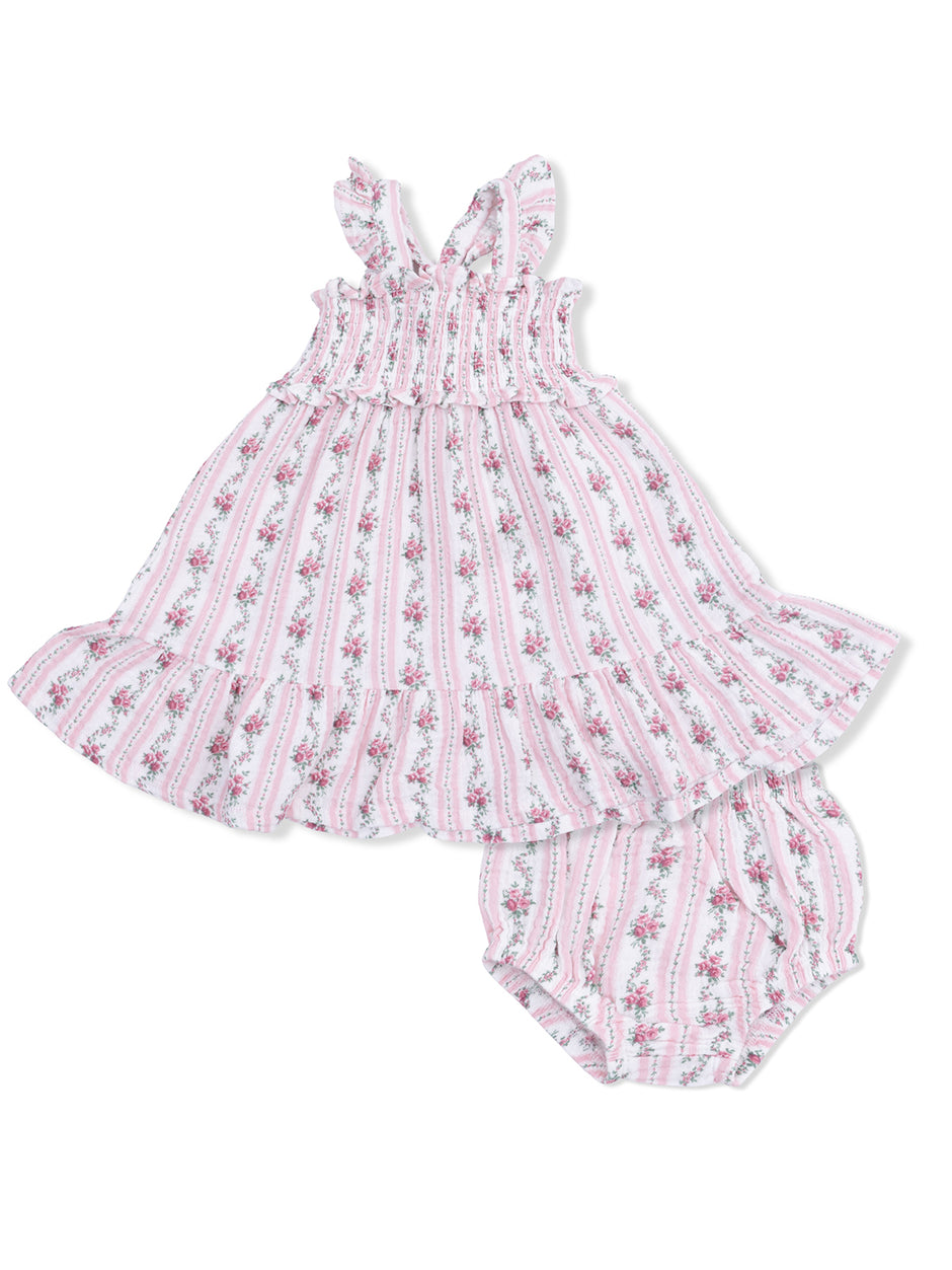 Pink floral dress with ruffled straps and matching bloomers on a white background. Perfect for summer outings.