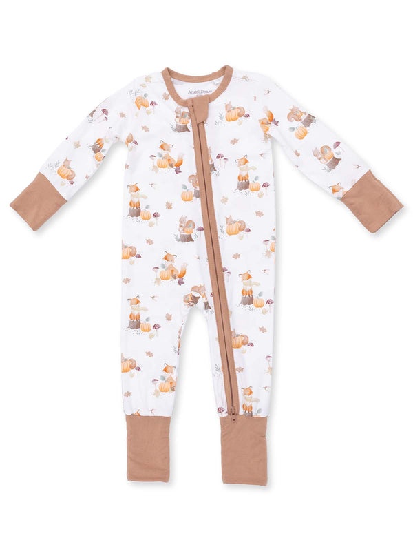 Infant sleeper onesie with fox and pumpkin pattern, featuring a front zipper and long sleeves.