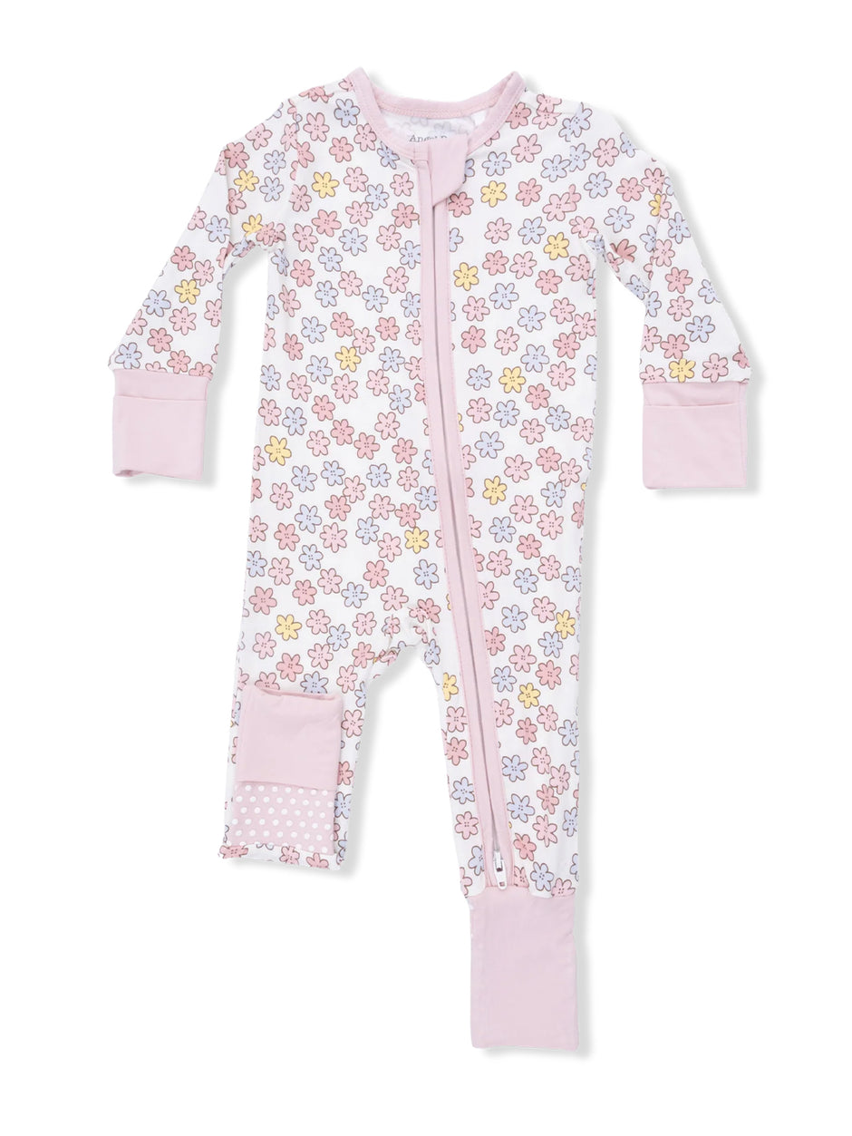 Pink baby onesie covered in colorful flowers with long sleeves and a front zipper.